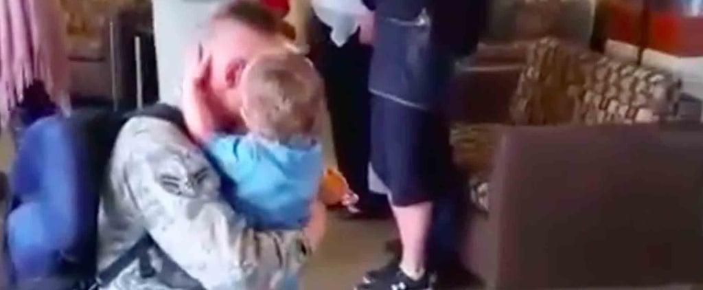Military Dad Reunites With His Daughter Holding a Sign