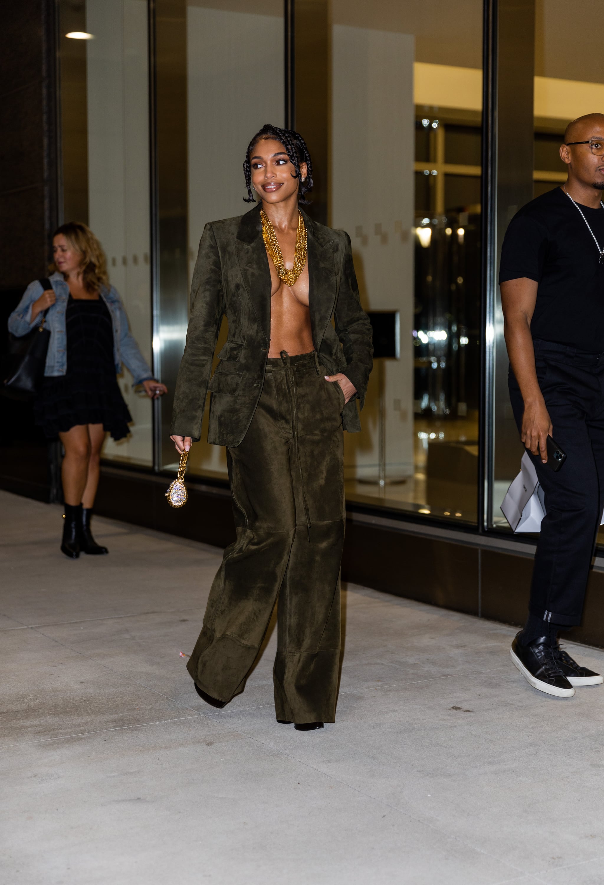 NEW YORK, NEW YORK - SEPTEMBER 14: Lori Harvey wearing khaki blazer and pants, micro bag outside Tom Ford on September 14, 2022 in New York City. (Photo by Christian Vierig/Getty Images)